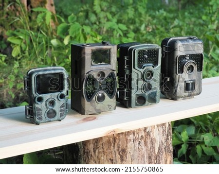 Comparison of different trail camera. Photo and video trap. Animal and surroundings monitoring device with motion sensor and night vision