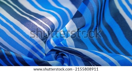 multicolored striped silk fabric. Mexican coloring theme bright colored striped pattern with abstract stripes. Background texture.  Royalty-Free Stock Photo #2155808911