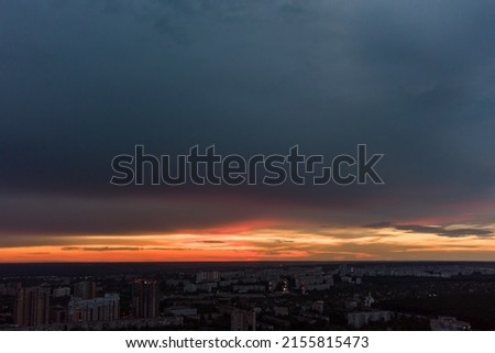 Dramatic sunset cloudscape view in city residential district. Aerial Kharkiv, Ukraine. Evening sky, cloudscape and street lights Royalty-Free Stock Photo #2155815473