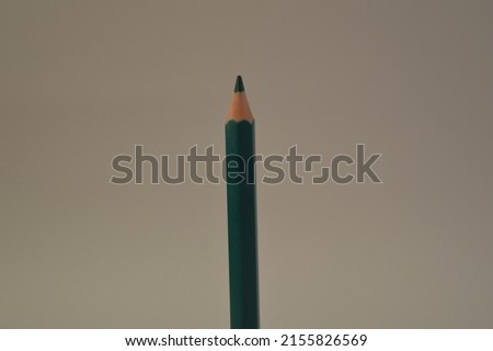 a colored pencil or crayon object that serves to color an image with a white background, negative space