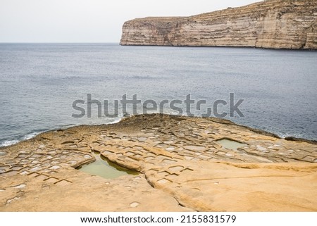 Xlendi salt pans pictured on the edge of Xlendi Bay on the island of Gozo, Malta.