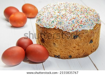 Easter pastries and eggs dyed in onion peel on a white wooden table. selective focus .High quality photo