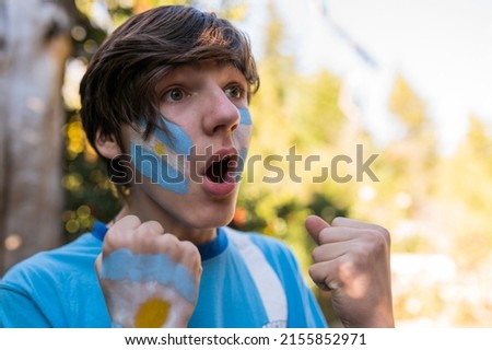 Fan of the Argentine team shouting the goal. Royalty-Free Stock Photo #2155852971