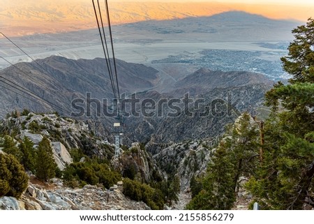 Cable car leading up to Mount San Jacinto in Palm Springs during sunset with pastel background.  Royalty-Free Stock Photo #2155856279