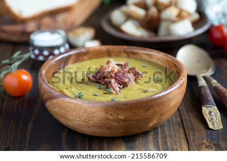 Pea soup with bacon Royalty-Free Stock Photo #215586709