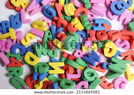 Group of many colored letters grouped on top of each other
