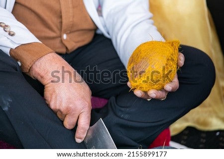 Indian Hindu wedding ritual coconut cutting