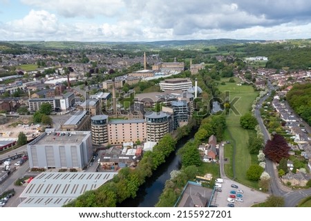 Aerial drone photo of the historic town of Shipley in the City of Bradford, West Yorkshire, England showing a Newley regenerated development of apartment buildings by the by the River Aire Royalty-Free Stock Photo #2155927201