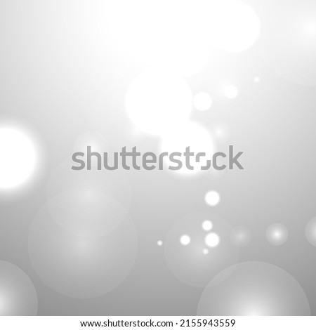 Silver Bokeh Christmas Background. Snow Flakes on Light Grey. Blurred Vector Design. Holiday Winter Backdrop With Glow and Overlay Effect. Season Bling Christmas Decoration.