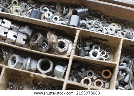 tapping screws made od steel, metal screw, iron screw, chrome screw, screws as a background, wood screw,  Royalty-Free Stock Photo #2155978683