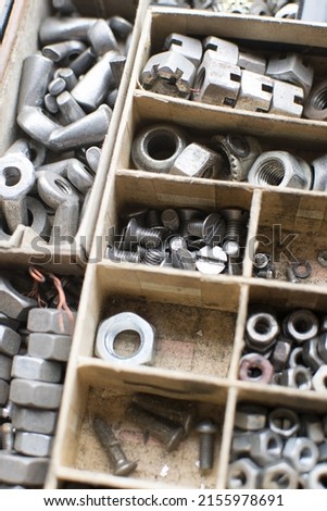 tapping screws made od steel, metal screw, iron screw, chrome screw, screws as a background, wood screw,  Royalty-Free Stock Photo #2155978691