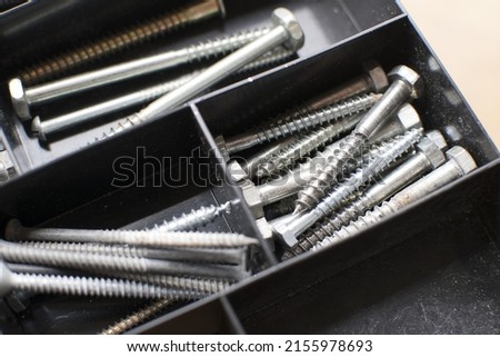 tapping screws made od steel, metal screw, iron screw, chrome screw, screws as a background, wood screw,  Royalty-Free Stock Photo #2155978693