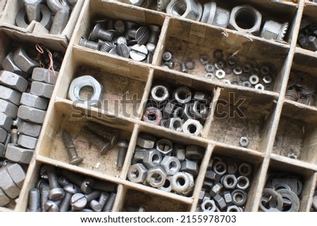 tapping screws made od steel, metal screw, iron screw, chrome screw, screws as a background, wood screw,  Royalty-Free Stock Photo #2155978703