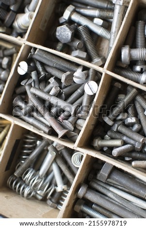 tapping screws made od steel, metal screw, iron screw, chrome screw, screws as a background, wood screw,  Royalty-Free Stock Photo #2155978719