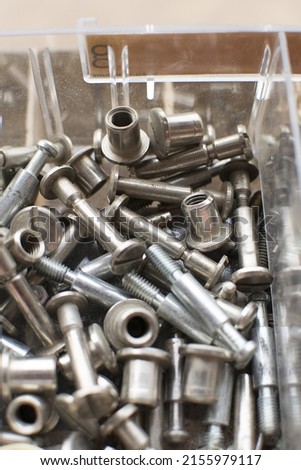 tapping screws made od steel, metal screw, iron screw, chrome screw, screws as a background, wood screw,  Royalty-Free Stock Photo #2155979117