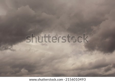 Summer cloudy sky background. Panoramic view with beautiful clouds. Horizontal cloudscape. High-resolution photography. Design element. Selective focus. Copy space. 