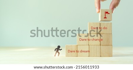 Step out of comfort zone or safe zone concept. Dare to dream, dare to change and dare to do. Motivational quote and encouragement to leave your comfort zone. Target and successful achievement icons.  Royalty-Free Stock Photo #2156011933
