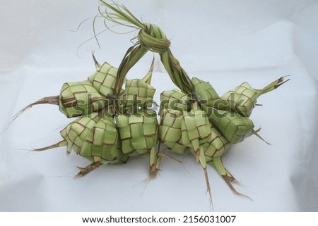 Ketupat or kupat is a typical maritime Southeast Asian dish made from rice wrapped in a wrapper made of woven young coconut leaves, or sometimes from other palm leaves.
