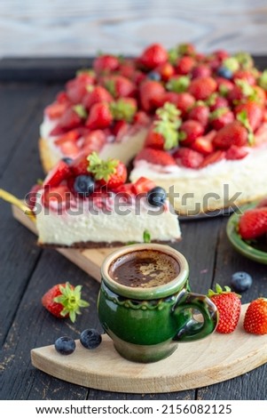 strawberry cheesecake vanilla cake with coconut and a cup of aromatic coffee