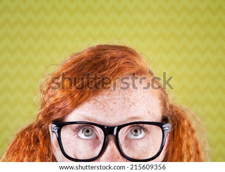 Funny nerdy girl looking up 