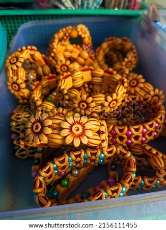 Different types of girls hand bracelets.  Colorful bracelets can be seen in the store. Wooden jewelry. Selective focus.