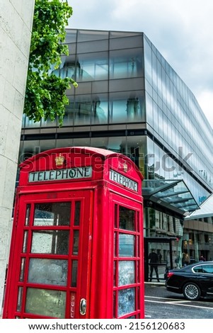 Red Telephone booth in London with reflection of St Paul's Cathedral in the backround. High quality photo