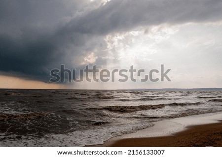 Rain clouds and sunshine over the Sea of Azov