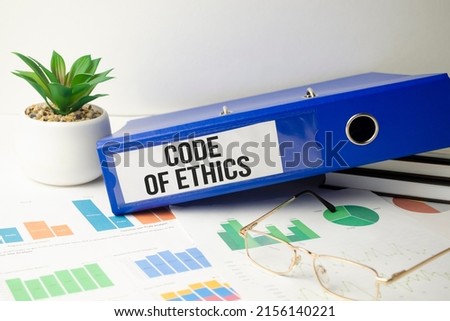 code of ethics Concept. Words on notebook and blue folder
