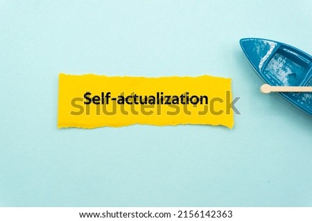 Self actualization.The word is written on a slip of colored paper. Psychological terms, psychologic words, Spiritual terminology. psychiatric research. Mental Health Buzzwords. Royalty-Free Stock Photo #2156142363