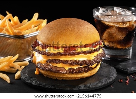 smash burger hamburger cheeseburger hamburgerin dark background Royalty-Free Stock Photo #2156144775