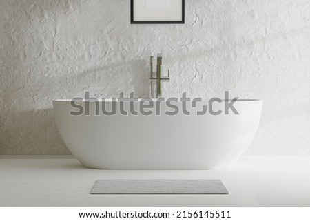 Bathtub, in front of white wall, deep hollow white tub, freestanding jacuzzi, window, bright bathroom. Royalty-Free Stock Photo #2156145511