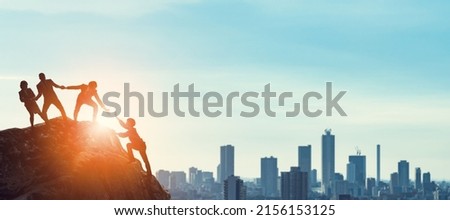 Group of businessperson climbing a mountain. Challenge of business concept. Royalty-Free Stock Photo #2156153125