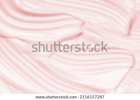 Pink cosmetic cream texture. Face creme, body lotion surface. Skincare creamy product background Royalty-Free Stock Photo #2156157287
