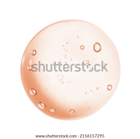 Serum gel toner drop. Liquid skincare product texture. Yellow pink cosmetic round swatch isolated on white background Royalty-Free Stock Photo #2156157295