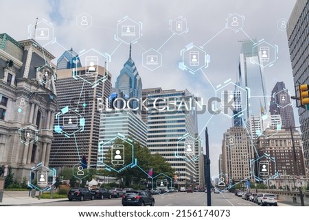 Summer day time cityscape of Philadelphia financial downtown, Pennsylvania, USA. City Hall neighborhood. Decentralized economy. Blockchain, cryptocurrency and cryptography concept, hologram