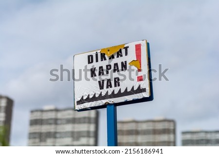 Road blocker with spikes sign. Car tyre trap warning traffic sign in Turkish.