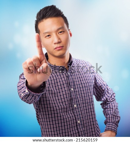 portrait of an asian man doing the one gesture