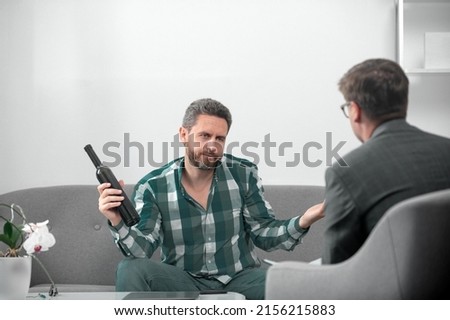 Solving problem, alcohol addiction, man alcohol abuse. Psychology, mental therapy concept. Drunk man patient and psychologist at psychotherapy session. Royalty-Free Stock Photo #2156215883