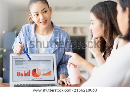 Group of asian young modern people in smart casual wear having a brainstorm meeting while sitting in office background. Business meeting, Planning, Strategy, New business development, Startup concept.