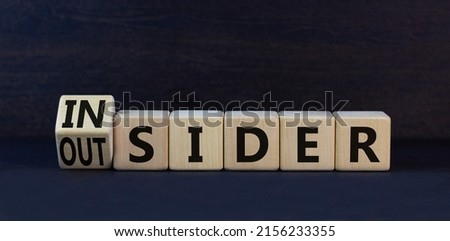 Insider or outsider symbol. Turned wooden cubes and changed the concept word Insider to Outsider. Beautiful black table black background. Business insider or outsider concept. Copy space. Royalty-Free Stock Photo #2156233355