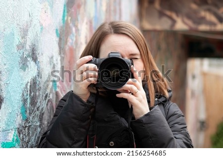 girl taking pictures in spring
