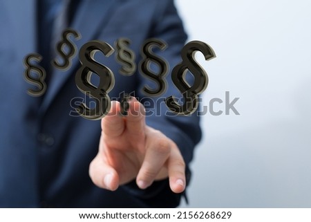 A businessman clicking on 3D rendered section symbols