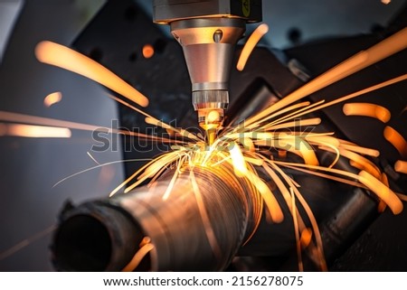 CNC Laser cutting of metal, modern industrial technology Making Industrial Details. The laser optics and CNC (computer numerical control) are used to direct the material or the laser beam generated. Royalty-Free Stock Photo #2156278075