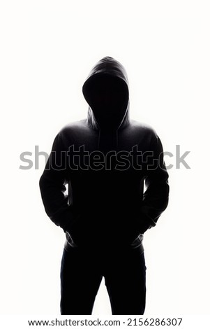 Man in Hood. Boy in a hooded sweatshirt. Male silhouette