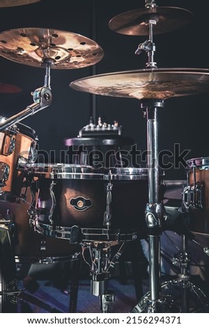 Close-up, part of a drum kit on a blurred background.