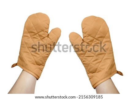 Hand with brown oven glove mitt isolated on white background Royalty-Free Stock Photo #2156309185