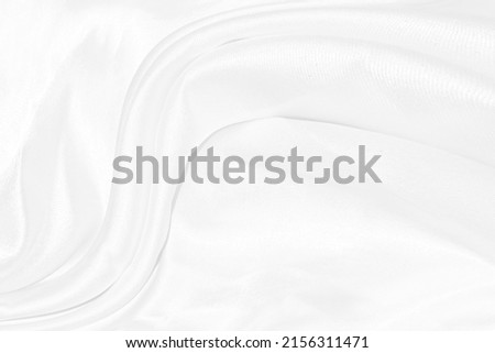 Texture, background, pattern. White cloth background abstract with soft waves, great for dresses or suits, where transparency and flow are required
