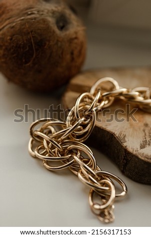 Gold chain on a wooden background