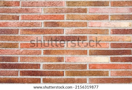 Pattern of rough bricks wall. Background texture for exterior and exterior design. Bricks texture for construction wallpapers. 