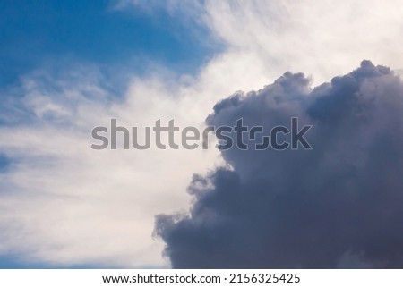 Summer cloudy dramatic blue sky background. Panoramic view with beautiful clouds. Horizontal cloudscape. High-resolution photography. Design element. Copy space.